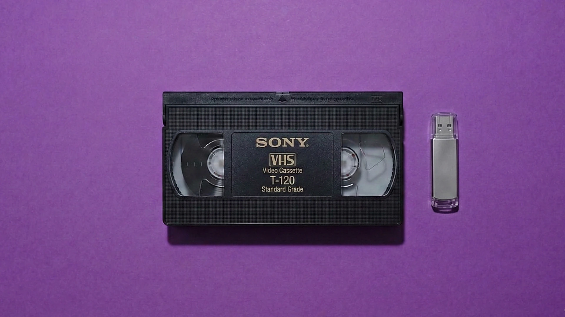 VHS tape with USB drive showing digital transfer