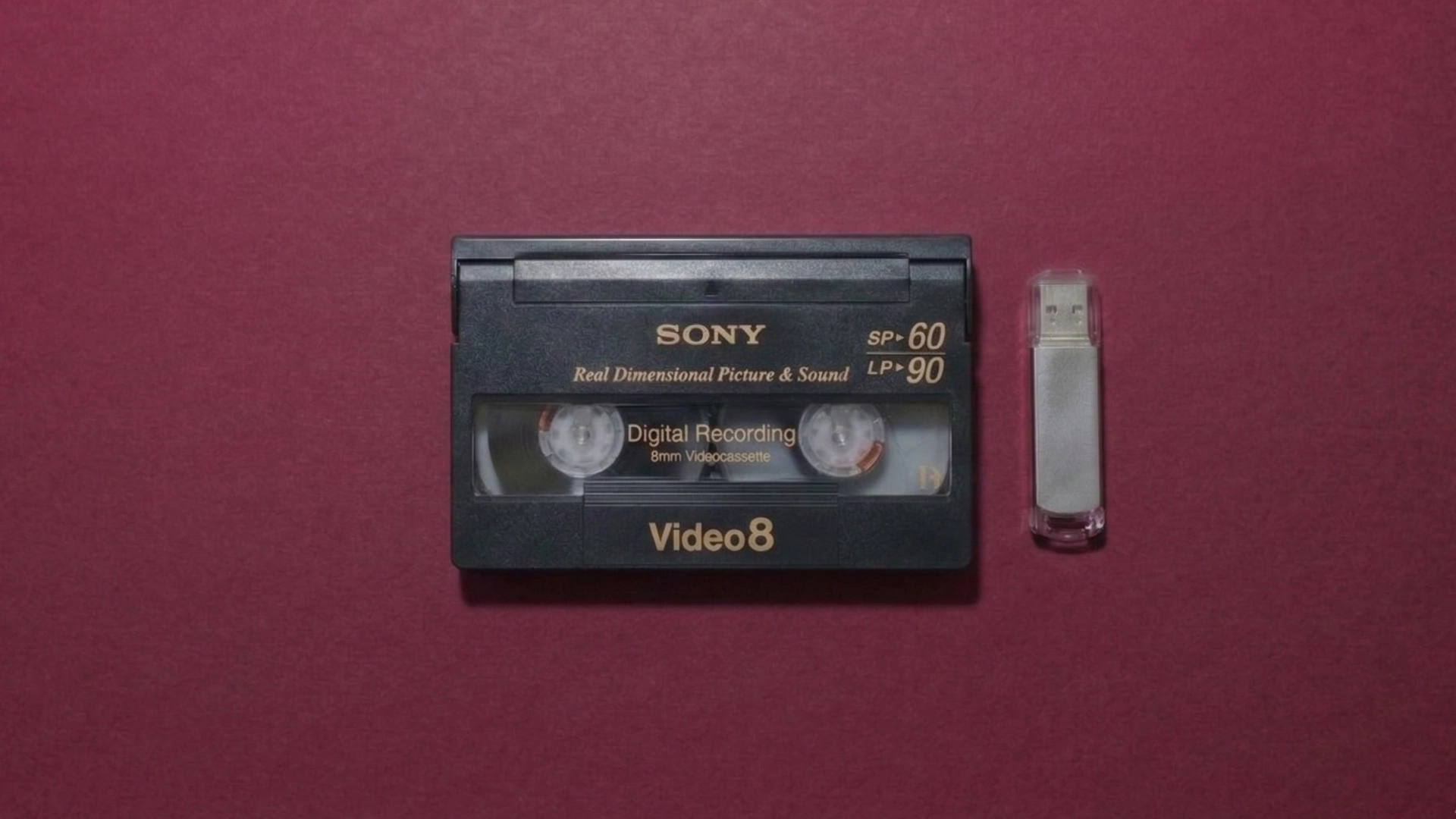 Video8 cassette with USB drive showing digital transfer